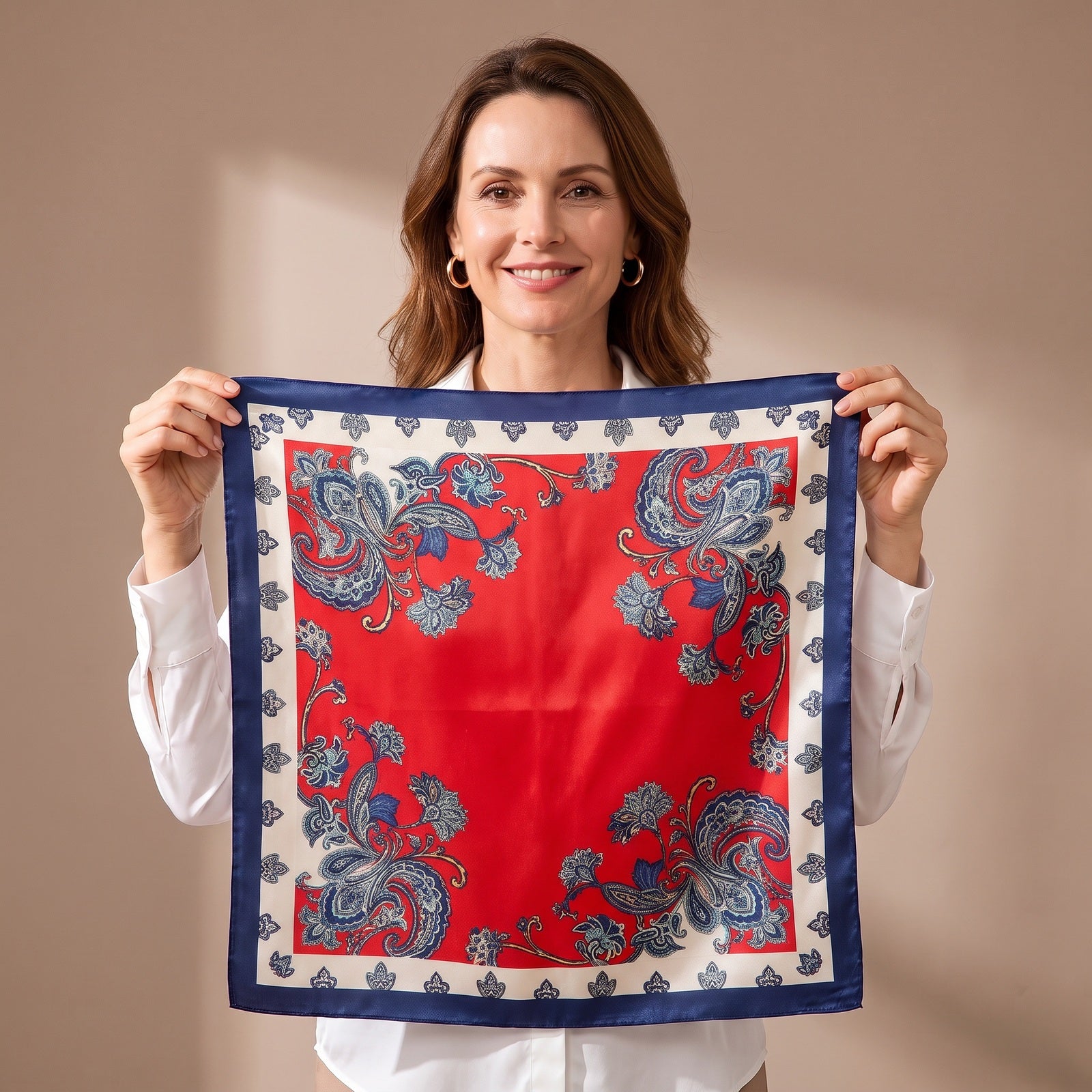 A woman holding the Red Floral Silk Satin Square Scarf 90x90cm open so the whole print is visible